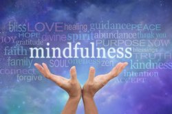 hands holding the word mindfulness 